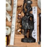 AN AFRICAN HARDWOOD FIGURE OF A LADY TOGETHER WITH TWO OTHER KNEELING FIGURES