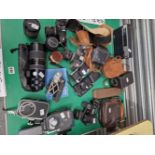 A COLLECTION OF STILL AND MOVIE CAMERAS, LENSES, VIEWERS, CARRYING BAGS, ETC.