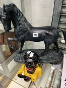 A CAST IRON MONEY BOX AND A LARGE HORSE FIGURE.