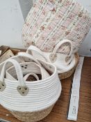 THREE WHITE TEXTILE AND WOVEN FIBRE BAGS TOGETHER WITH A QUILT