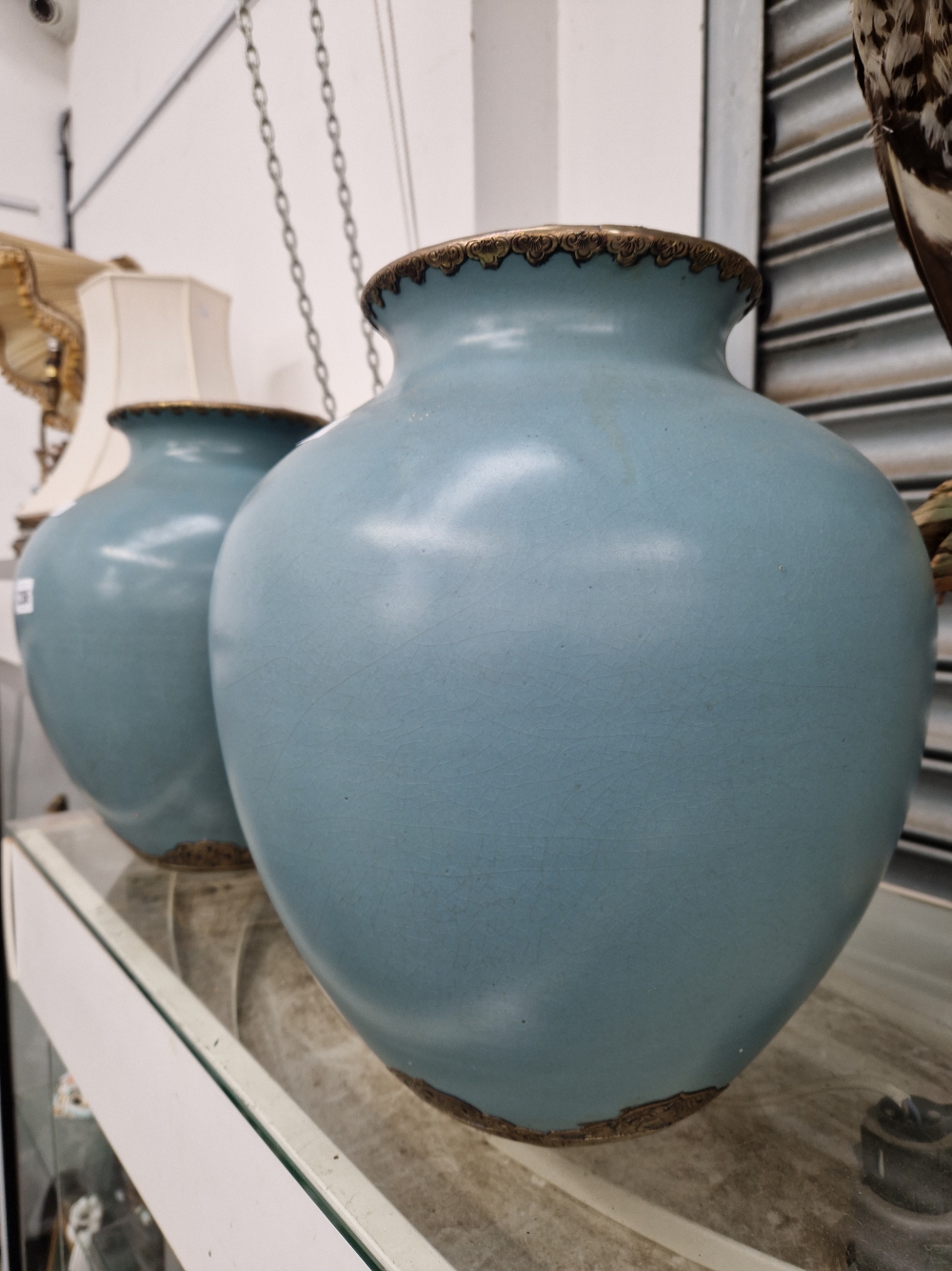 A PAIR OF OREINTAL EGGSHELL BLUE CRACKLE GLAZE BRASS MOUNTED LARGE VASES.