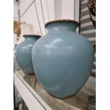 A PAIR OF OREINTAL EGGSHELL BLUE CRACKLE GLAZE BRASS MOUNTED LARGE VASES.