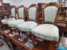 A SET OF FOUR 19th C. WALNUT SALON CHAIRS, WITH INDIVIDUAL CARVED UPPER CREST RAILS