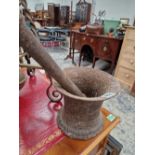 AN ANTIQUE IRON AND PESTLE AND MORTAR