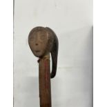 AN AFRICAN CLUB WTH CARVED FIGURE POMMEL.