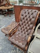 A BUTTON LEATHER UPHOLSTERED ARM CHAIR AND MATCHING FOOT STOOL