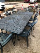 A LARGE CAST ALLOY GARDEN TABLE AND EIGHT CHAIRS