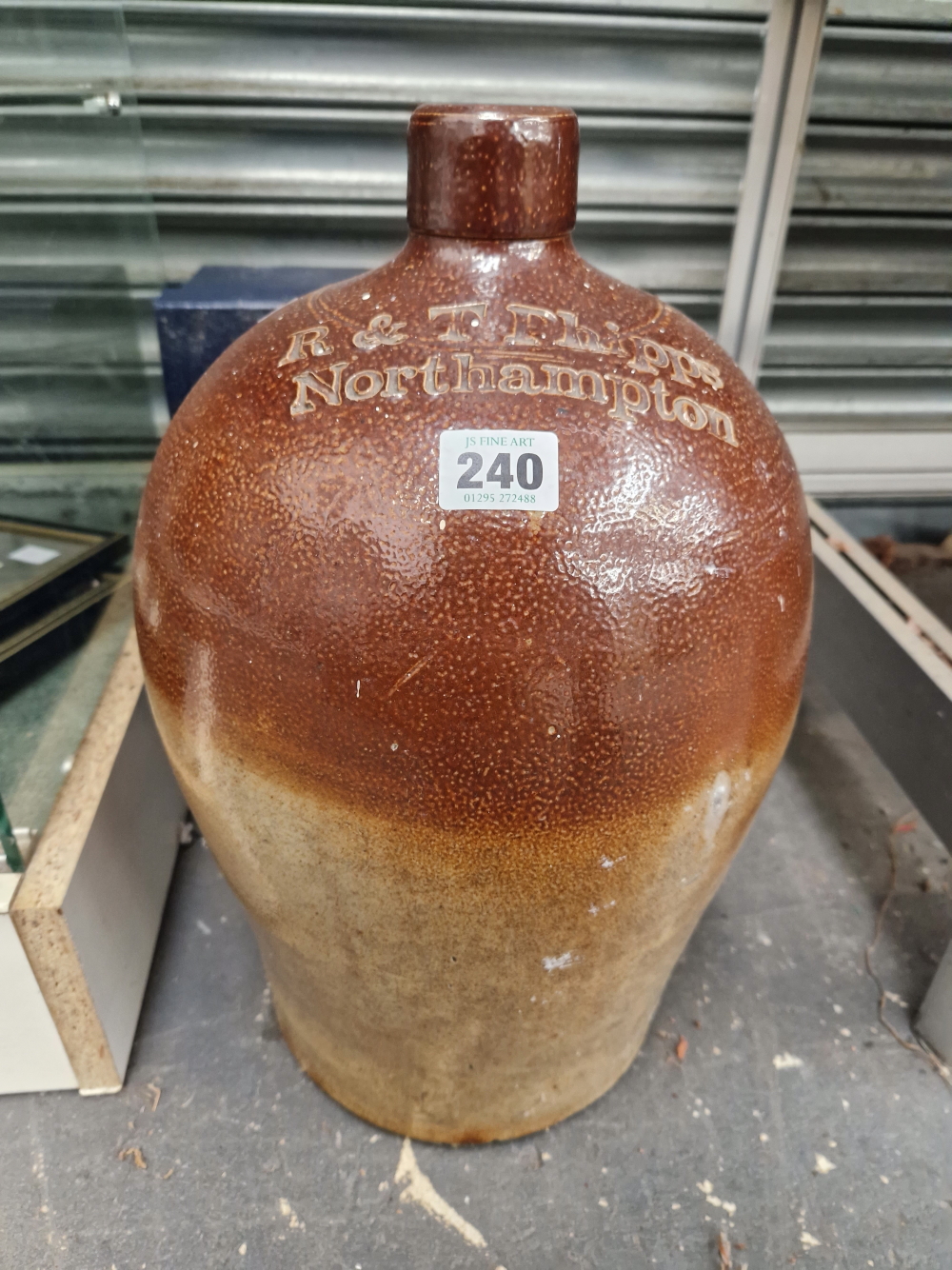 A LARGE TWO TONE FLAGON, SIGNED R & T PHIPPS, NORTHAMPTON.