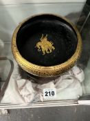 A VINTAGE EASTERN GILT DECORATED SHALLOW BOWL WITH WINGED ELEPHANT.