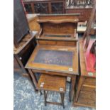 AN EDWARDIAN INLAID DAVENPORT DESK.