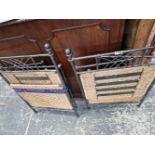 TWO FOLDING IRON AND RATTAN STANDS