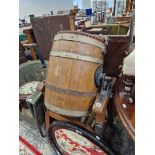 AN ANTIQUE BUTTER CHURN ON STAND