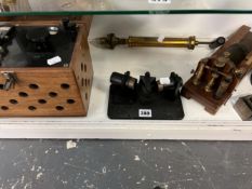 A VINTAGE REFRACTION PRISM, A POTENTIOMETER, A VACUUM PUMP AND OTHER SCIENTIFIC APPARATUS.