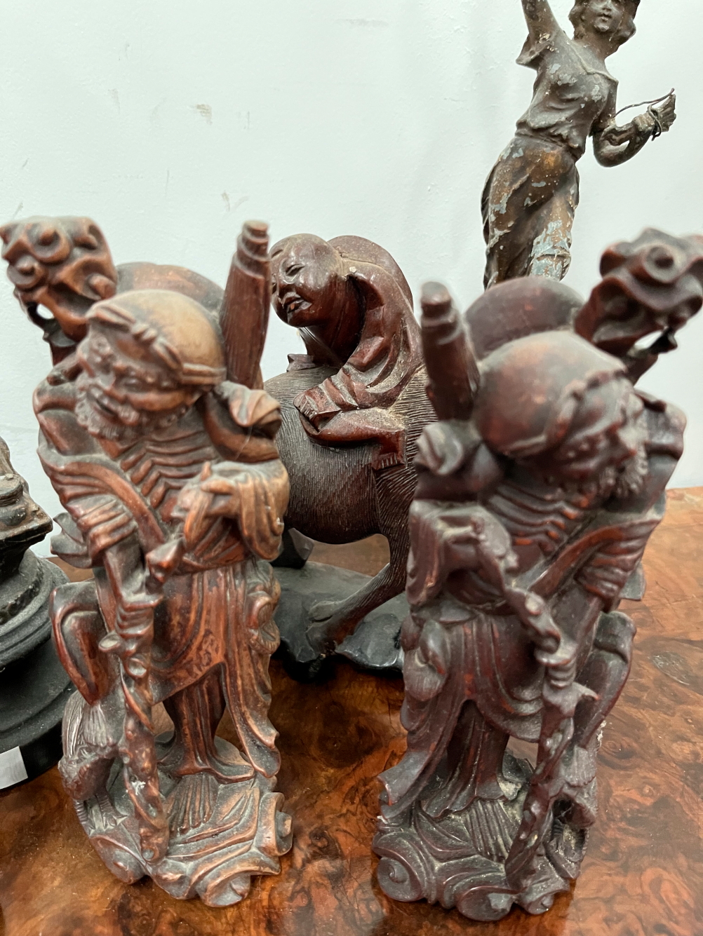 FOUR CHINESE CARVED WOOD FIGURES, ANOTHER IN SOAPSTONE, A PAIR OF SPELTER FIGURES AND AN IRON BEAR. - Image 3 of 4