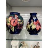 A LARGE MOORCROFT BULBOUS VASE, AND A SIMILAR SMALLER EXAMPLE WITH ORIGINAL PAPER LABEL.