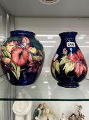 A LARGE MOORCROFT BULBOUS VASE, AND A SIMILAR SMALLER EXAMPLE WITH ORIGINAL PAPER LABEL.