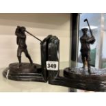 A PAIR OF BRONZE MOUNTED MARBLE GOLFING BOOK ENDS.