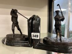 A PAIR OF BRONZE MOUNTED MARBLE GOLFING BOOK ENDS.