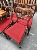 A SET OF FOUR EARLY VICTORIAN ROSEWOOD DINING CHAIRS.