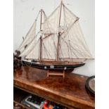A SCALE MODEL OF THE TWO MASTED YACHT BLUENOSE UNDER FULL SAIL