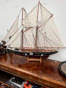 A SCALE MODEL OF THE TWO MASTED YACHT BLUENOSE UNDER FULL SAIL