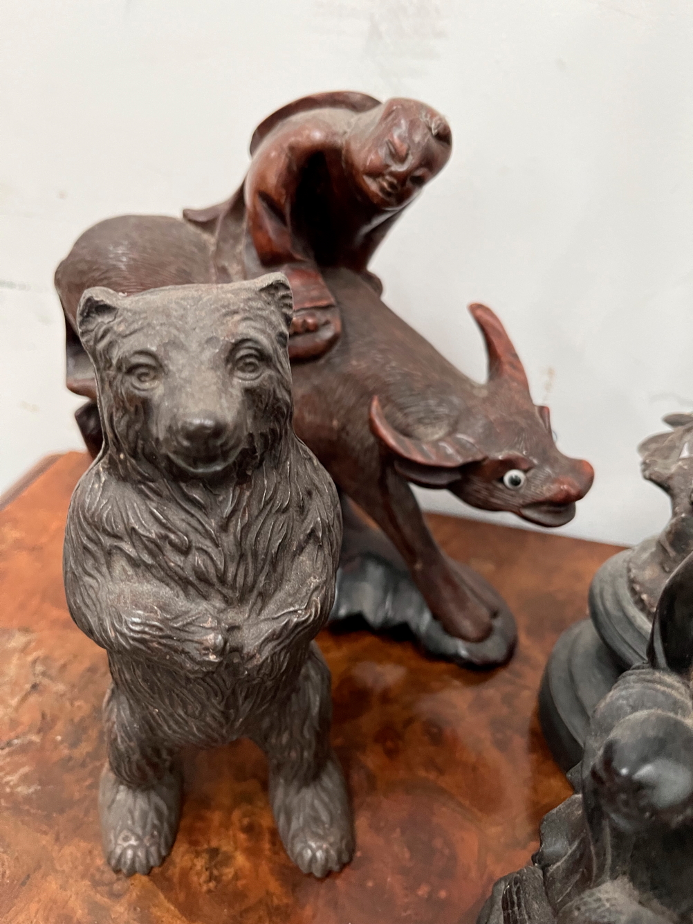 FOUR CHINESE CARVED WOOD FIGURES, ANOTHER IN SOAPSTONE, A PAIR OF SPELTER FIGURES AND AN IRON BEAR. - Image 2 of 4