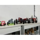 A GROUP OF DECORATIVE TINPLATE AND CEAMIC MODEL TRACTORS, A LANDROVER AND A TRACTION ENGINE.