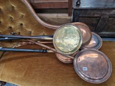 FIVE ANTIQUE COPPER AND BRASS WARMING PANS