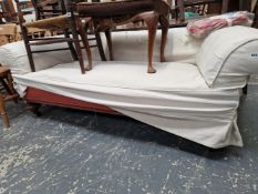 A VICTORIAN SMALL CHESTERFIELD SETTEE ON TURNED CARVED LEGS