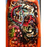 A LARGE COLLECTION OF JEWELLERY TO INCLUDE HARDSTONE BEADS AND OTHER BEADED NECKLACES AND BRACELETS.