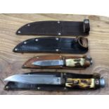 TWO VINTAGE SHEATH KNIVES AND TWO FURTHER SHEATHS.