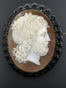 A 19th CENTURY CLASSICAL PORTRAIT CAMEO MOUNTED WITH A BLACK MOURNING TYPE FRAME. MEASURMENTS 5.0