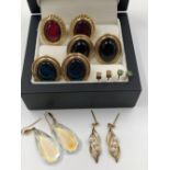 THREE PAIRS OF CABOCHON SET EARRINGS, A PAIR OF EMERALD STUDS AND A PAIR OF CUBE STUDS, AND A PAIR