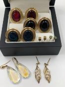 THREE PAIRS OF CABOCHON SET EARRINGS, A PAIR OF EMERALD STUDS AND A PAIR OF CUBE STUDS, AND A PAIR
