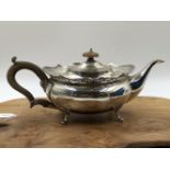 A HALLMARKED SILVER REGENCY STYLE TEAPOT WITH PIERCED SCALLOPED UPPER RING. WEIGHT 691grms.