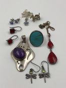 SILVER JEWELLERY TO INCLUDE A LILAC FLORAL CZ PENDANT AND EARRING SET, A SCOTTIE DOG CHARM, DRAGON