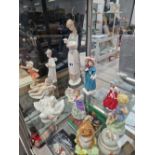 A COLLECTION OF FIGURINES TO INCLUDE NAO, ROYAL WORCESTER, LLADRO, BESWICK, AND ROYAL DOULTON.