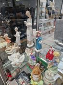 A COLLECTION OF FIGURINES TO INCLUDE NAO, ROYAL WORCESTER, LLADRO, BESWICK, AND ROYAL DOULTON.