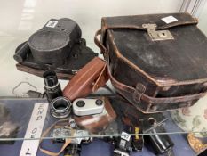 AN ENSIGN AUTOKINECAM EXPOSURE CALCULATOR WITH CASE, AN FOCORRECT BY H SCHNEIDER @ CO HAMBURG, AND A