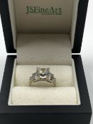 A 14K STAMPED ART DECO STYLE RING SET WITH CUBIC ZIRCONIAS, ASSESSED AS 14ct WHITE GOLD. WEIGHT 5.