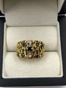 A BRUTALIST SAPPHIRE AND DIAMOND RING, STAMPED 750, ASSESSED AS 18ct GOLD, SIGNED WITH INDISTINCT
