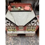 A TWIN GABLED DOLLS HOUSE WITH SEVEN ROOMS AND SOME FITTINGS