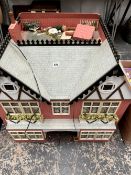 A TWIN GABLED DOLLS HOUSE WITH SEVEN ROOMS AND SOME FITTINGS