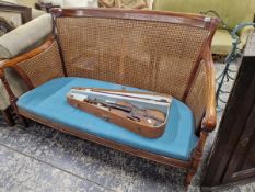 AN ANTIQUE SHOW FRAME BERGERE TWO SEAT SETTEE
