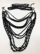 AN ERICKSON BEAMON CHANDELIER MULTI STRAND BLACK BEADED NECKLACE, TOGETHER WITH TWO FURTHER BLACK