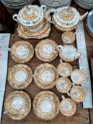 AN EARLY VICTORIAN PORCELAIN PART TEA AND COFFEE SERVICE WITH GILDING ON ORANGE GROUNDS