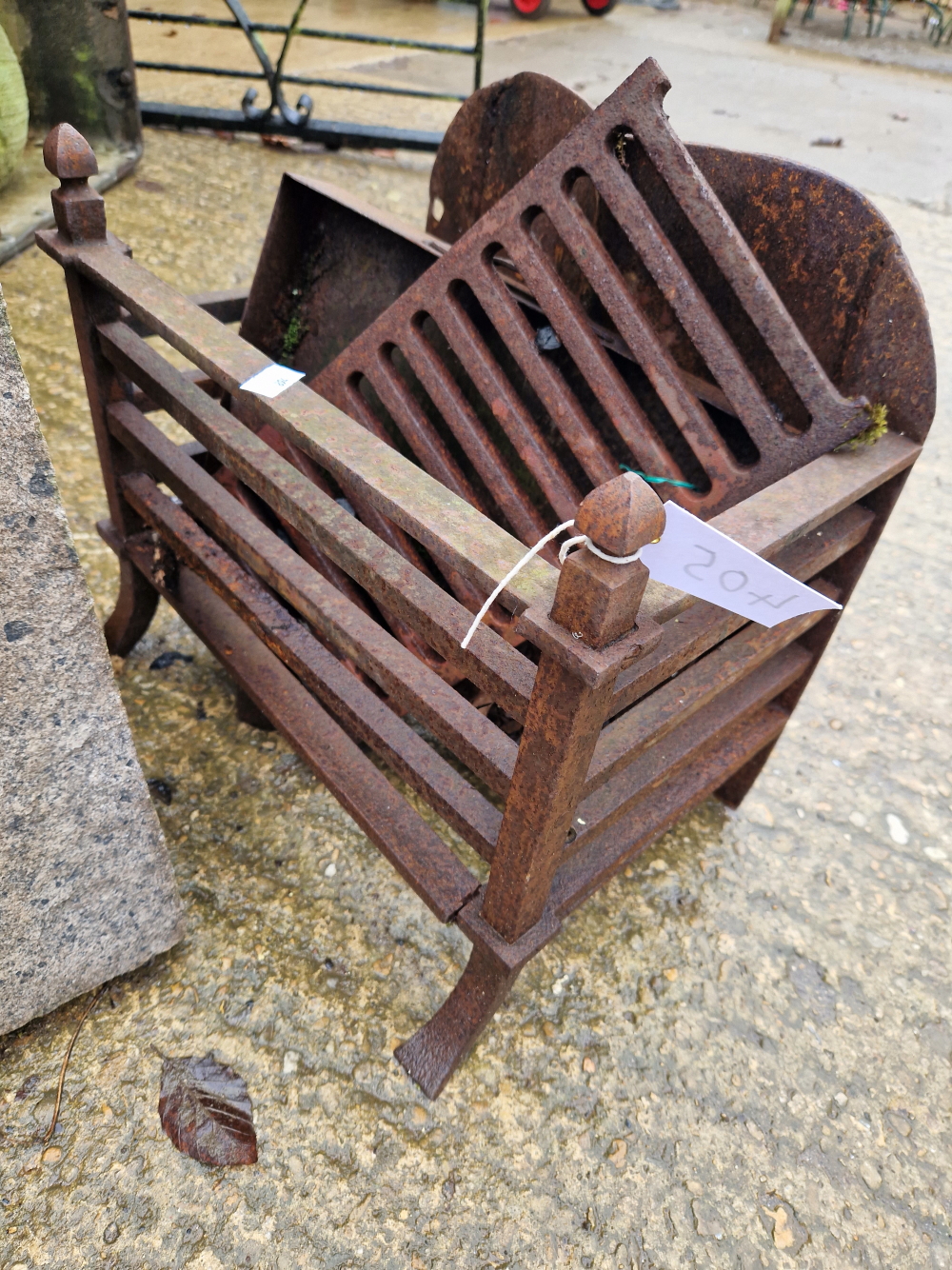 A SMALL IRON FIRE GRATE