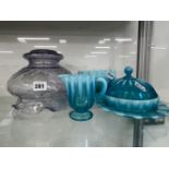 A VINTAGE OPAQUE BLUE GLASS BUTTER DISH, TOGETHER WITH JUG AND BOWL AND A GLASS LIGHT SHADE.