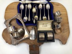 HALLMARKED SILVER TO INCLUDE SEVEN NAPKIN RINGS, A CASED SET OF SIX TEA SPOONS AND A PAIR OF SUGAR