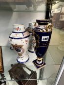 A PAIR OF FRENCH ARMORIAL LIDDED VASES AND A MINTONS TALL VASE.